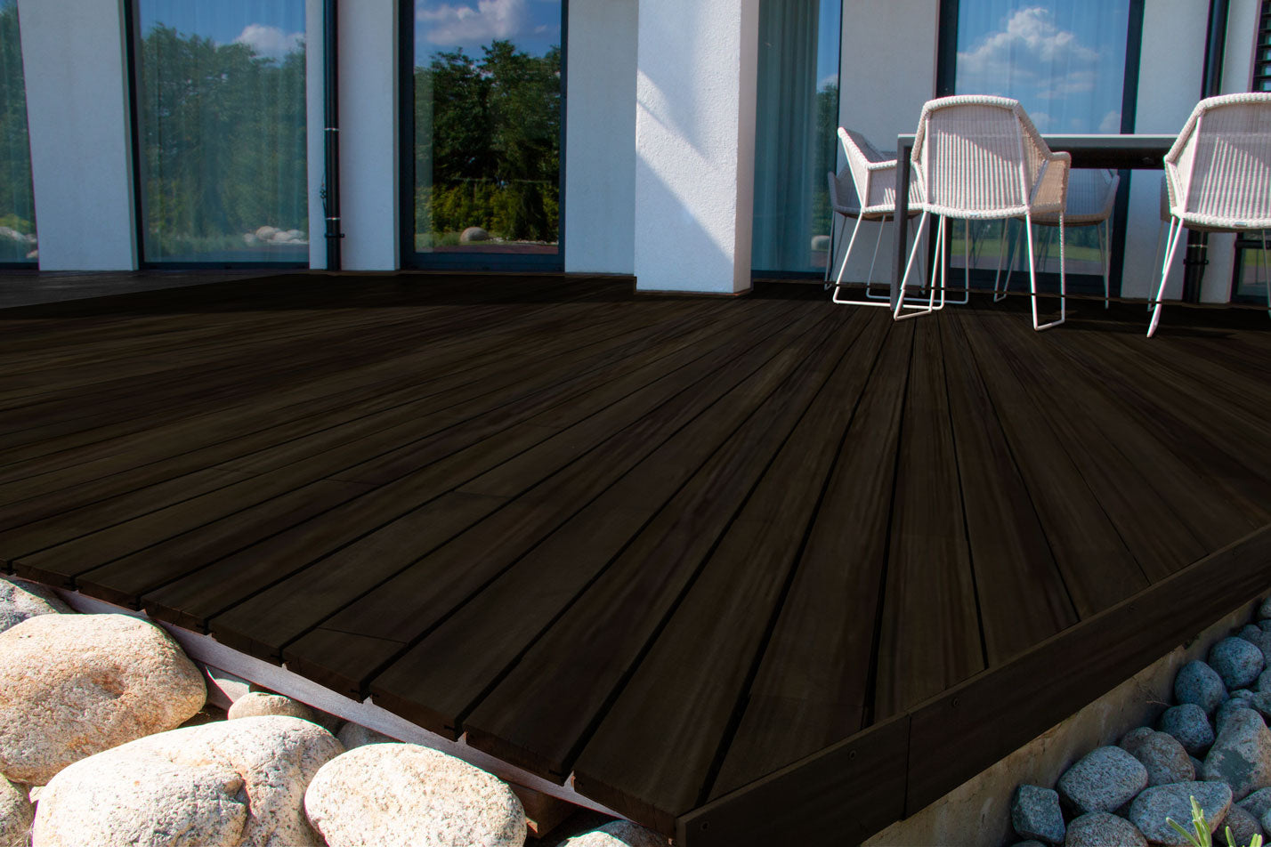 Liquid Wood Wood'n Stain in Classic Black by Retique It, 16 oz, showing a close-up of a stained wood deck surface.