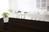 Retique It Liquid Wood Wood'n Stain in Classic Black applied to a wooden tabletop, showcasing smooth, even stain coverage.