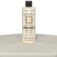 Retique It Liquid Wood Wood'n Primer in bleached wood finish, 8 fl oz, shown on a table surface for wood refinishing projects.