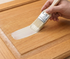 Retique It Universal Liquid Wood Kit in bleached wood finish applied to cabinet surface, showcasing wood grain and finish details.