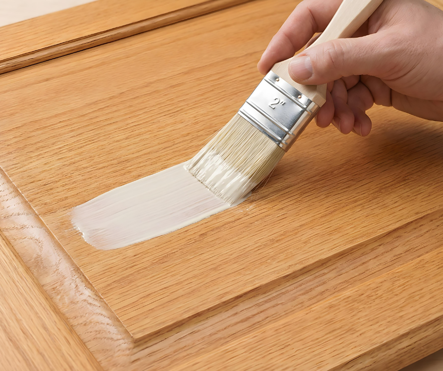 Retique It Universal Liquid Wood Kit in bleached wood finish applied to cabinet surface, showcasing wood grain and finish details.